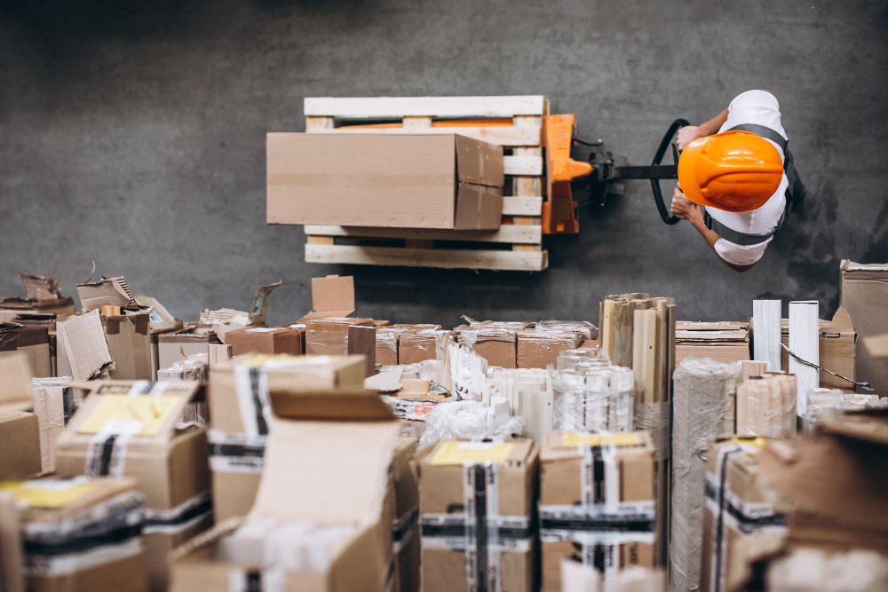 young-man-working-warehouse-with-boxes